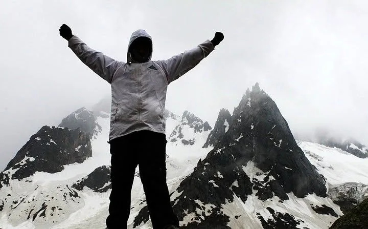 Pranab celebrating on a snowy mountain summit